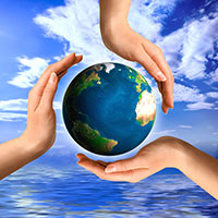 Conceptual recycling symbol made from hands and a small Earth globe